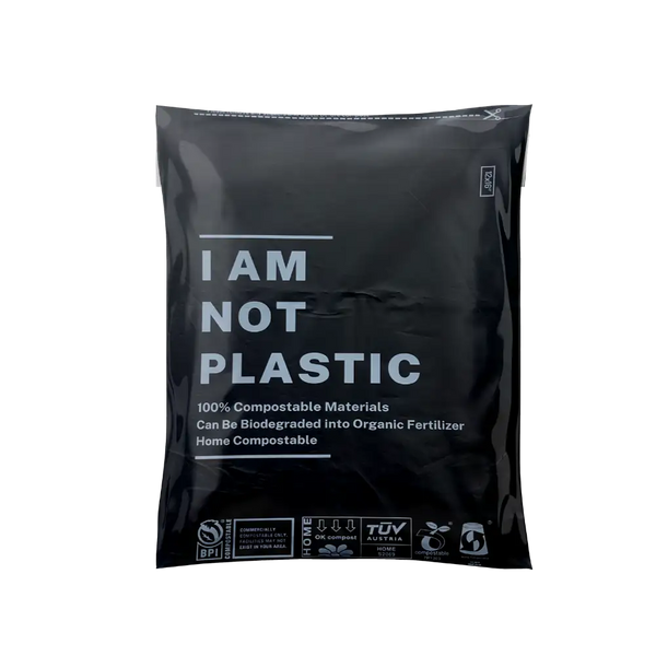 Black compostable bag with 'I AM NOT PLASTIC' text on a white background