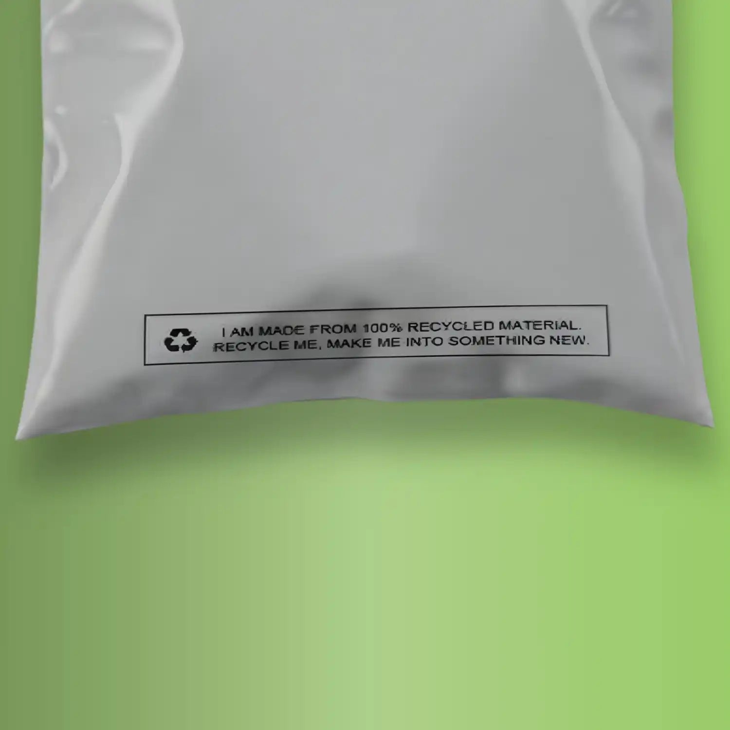the bottom of a 100% grey mailing bag on green background
