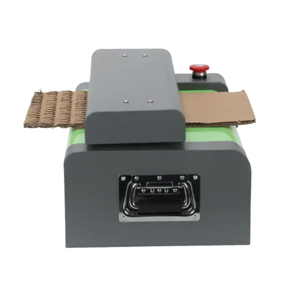 Cardboard shredder in use at the side