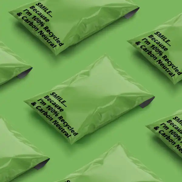 Full stock of green recycled mailing bag on green background